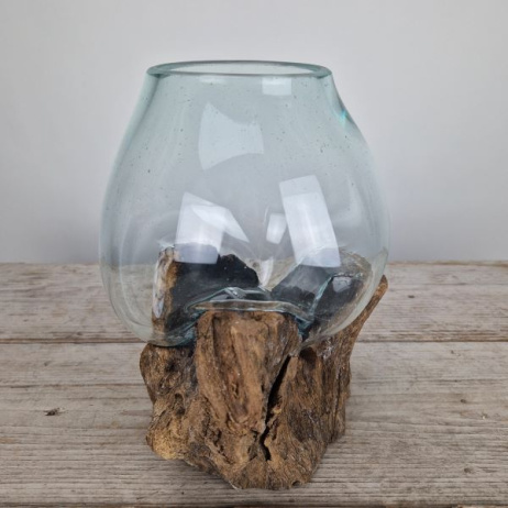 Glazen druppelvaas op hout (o)